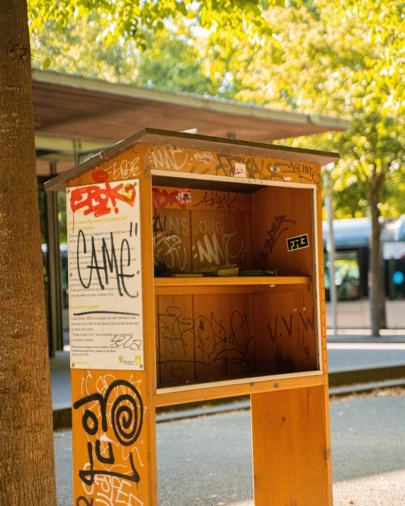 a book case in front of a bus stop