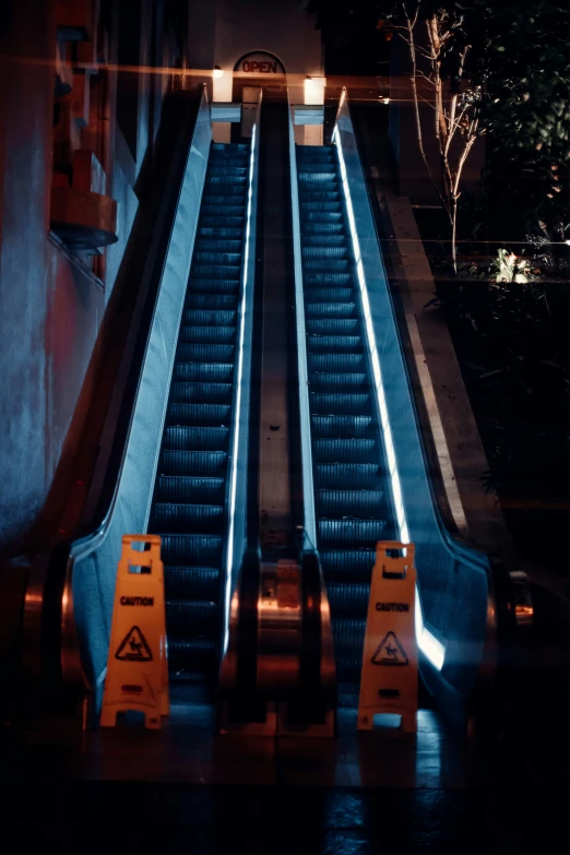 a po of the stairs in an airport at night