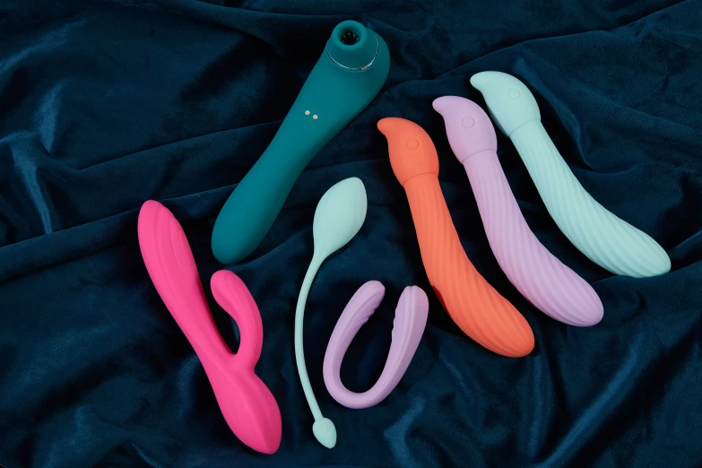 several colorful toothbrushes, curlers and curler holders