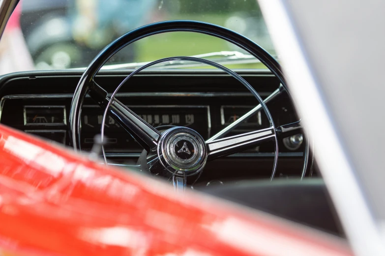 the dashboard and steering wheel from an old model car
