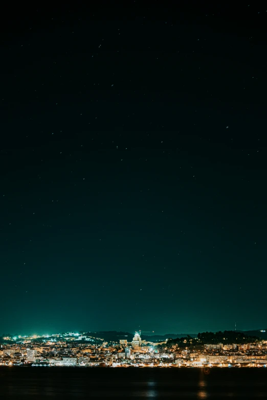 a night time view of a town with lights