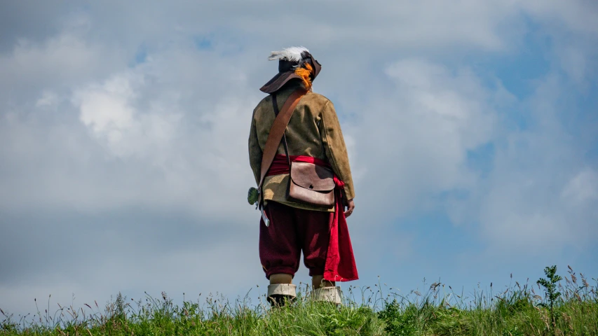 there is a man that has some kind of backpack on him