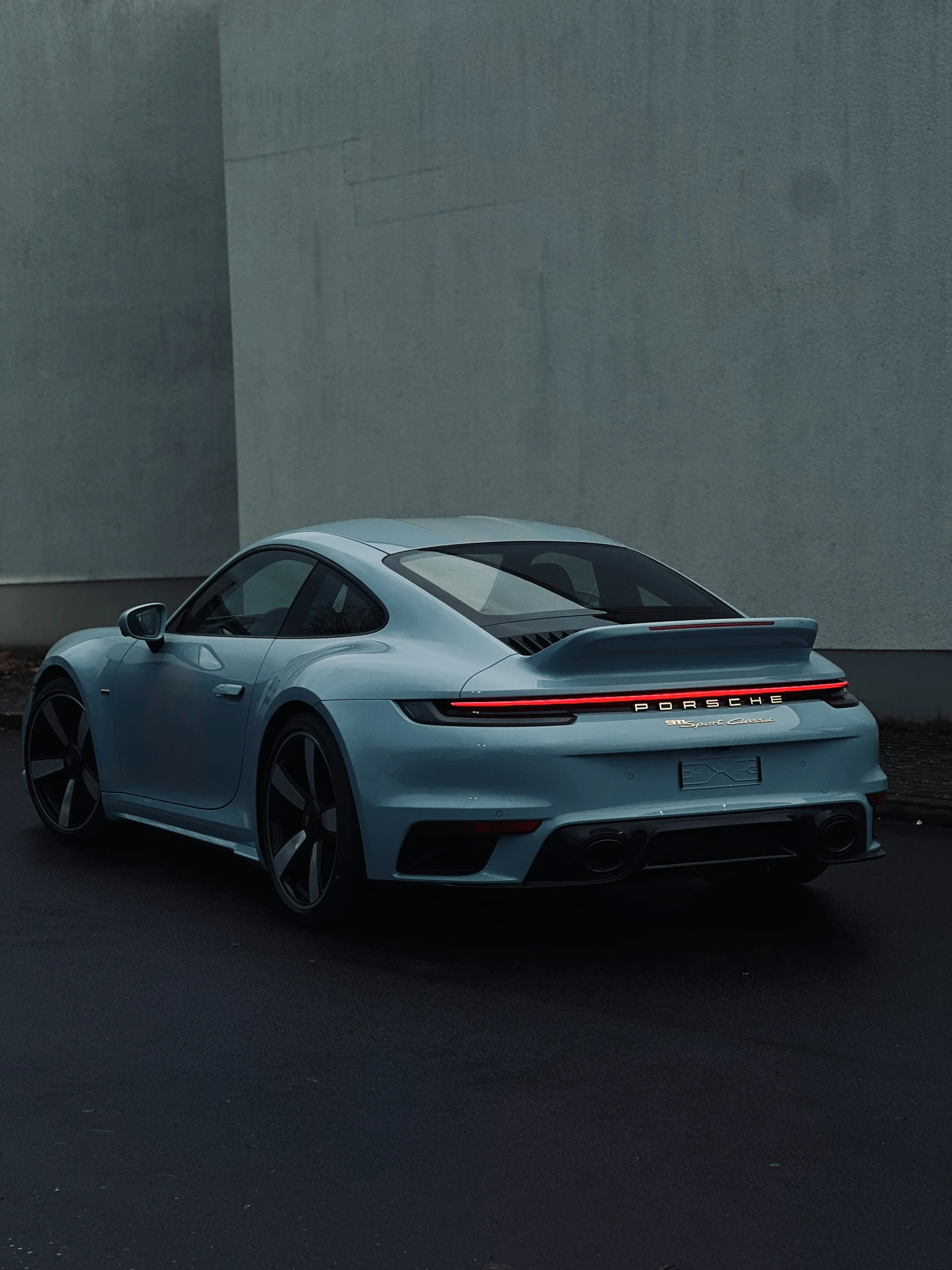 a gray car on a city street with no people around