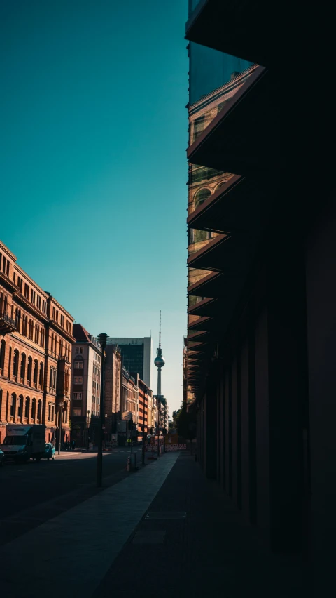 a street scene with buildings and cars in the city