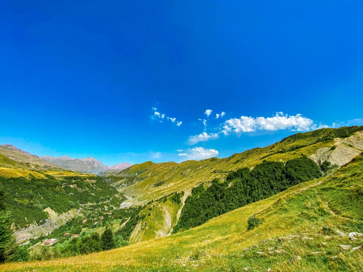 green hills and the blue sky on a sunny day