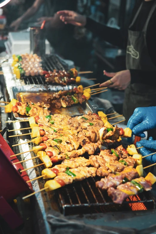 a food line with skewers filled with food