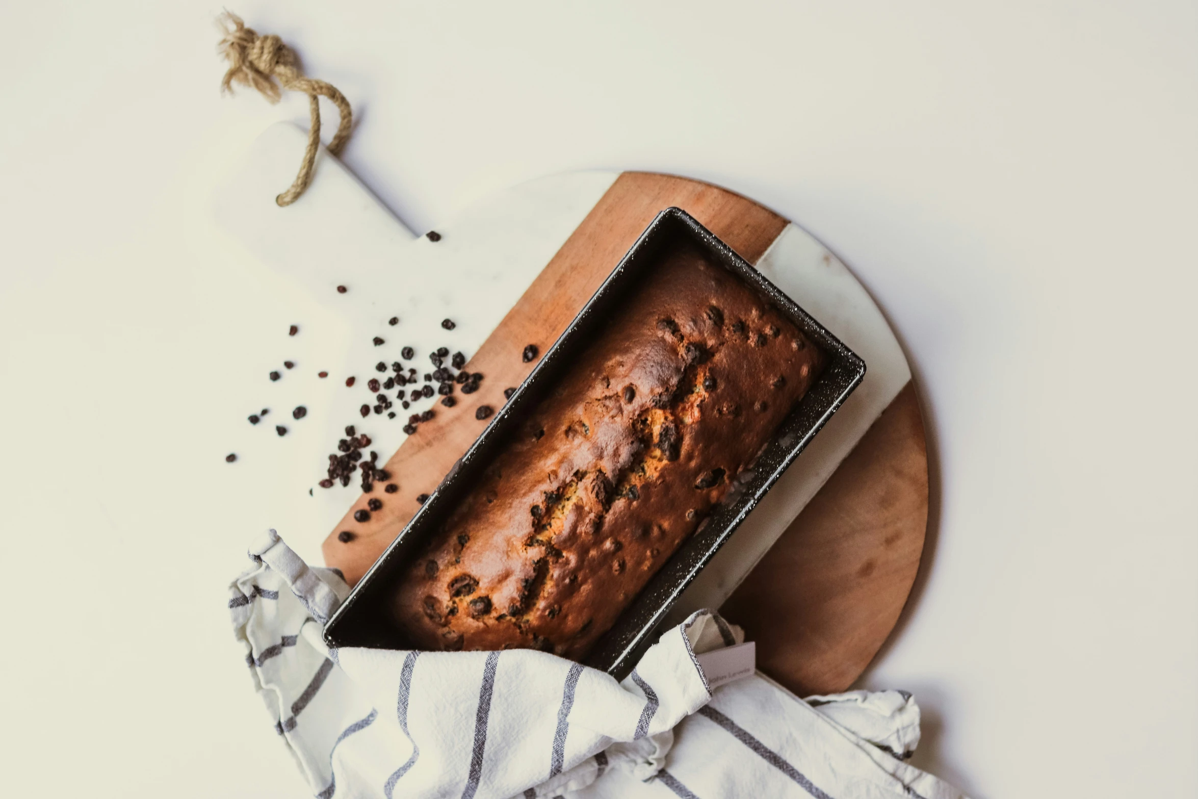 a loaf of bread is next to a metal tray