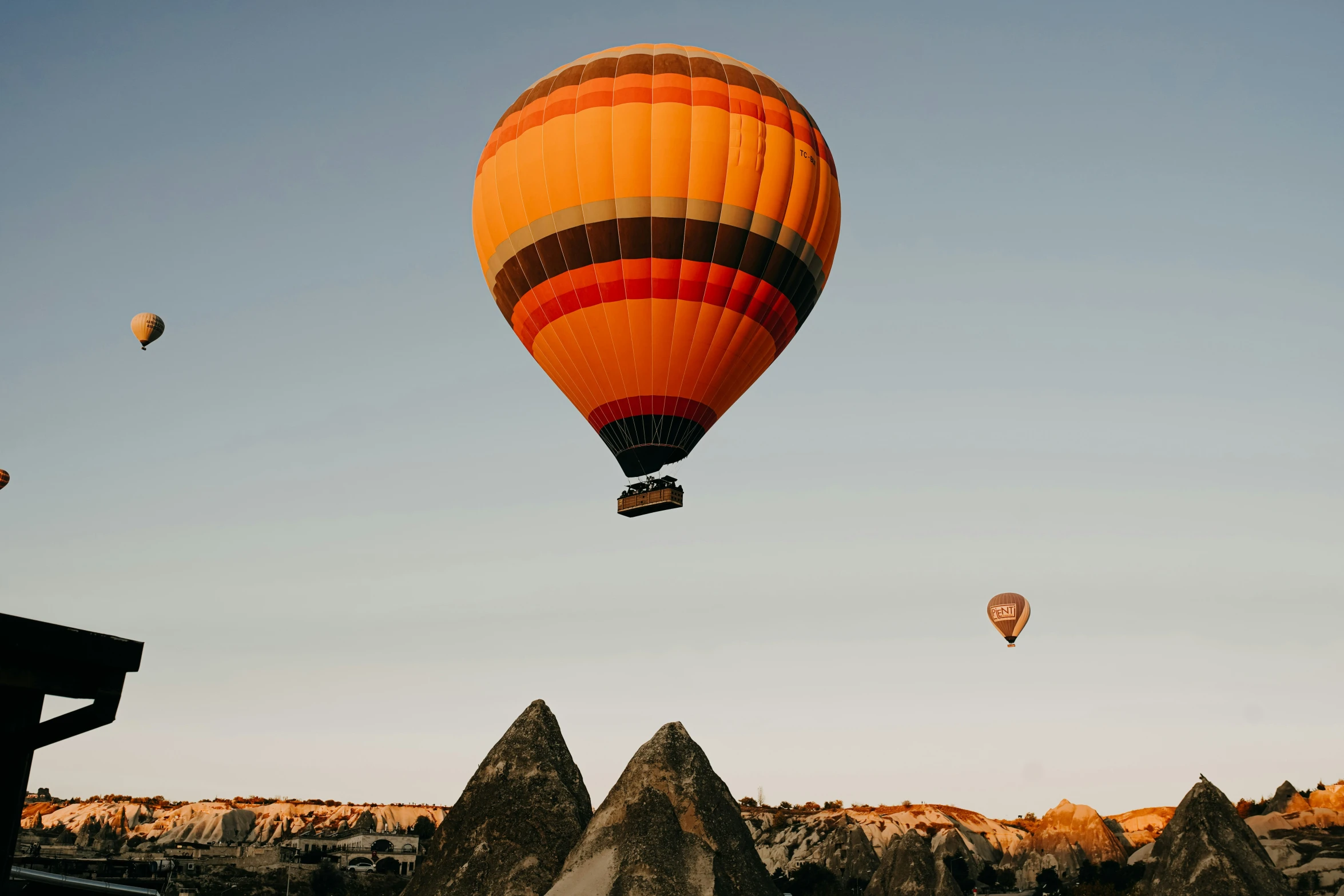 two  air balloons that are flying in the sky