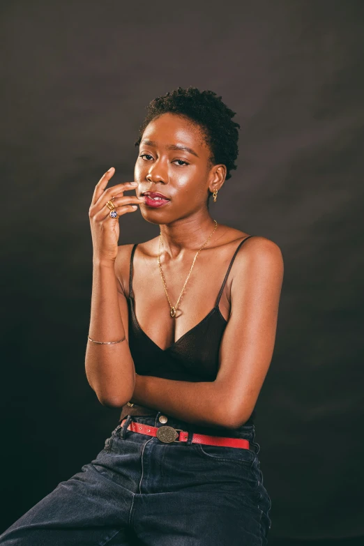 a black woman sitting on top of a chair