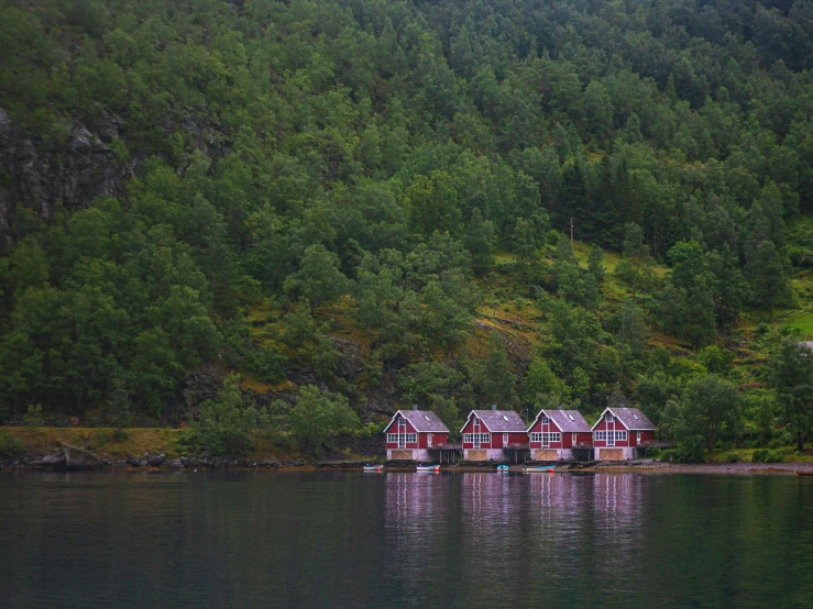 a bunch of small houses floating on top of water