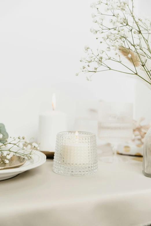 a close - up of some candles and a glass