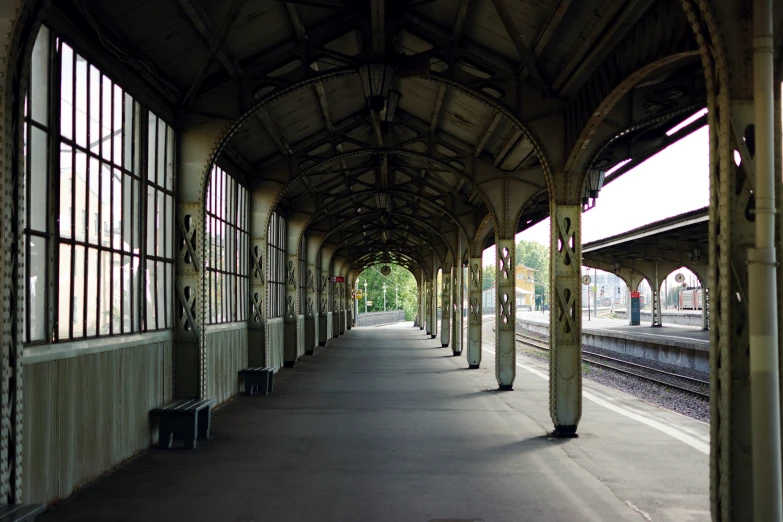 this is a view inside a covered train station with lots of windows