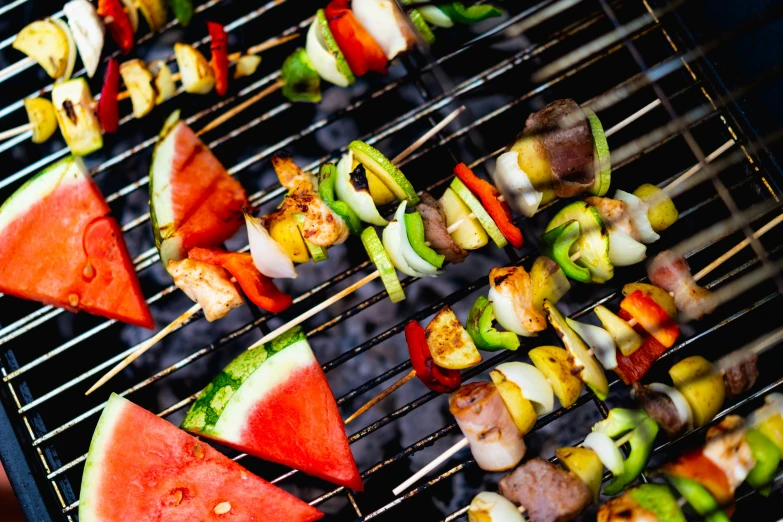 an arrangement of food on a charcoal grill
