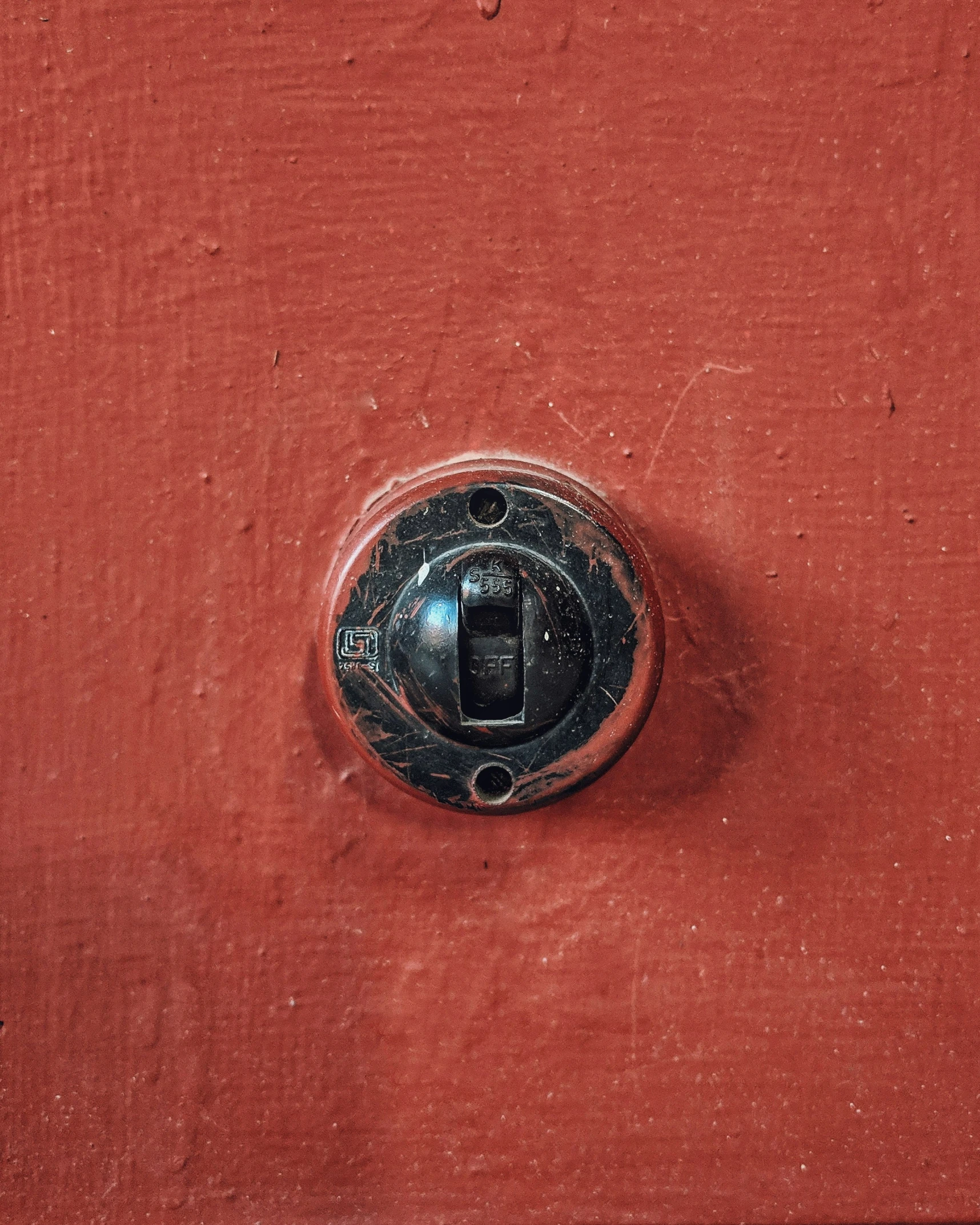 a black door with a metal lock on it