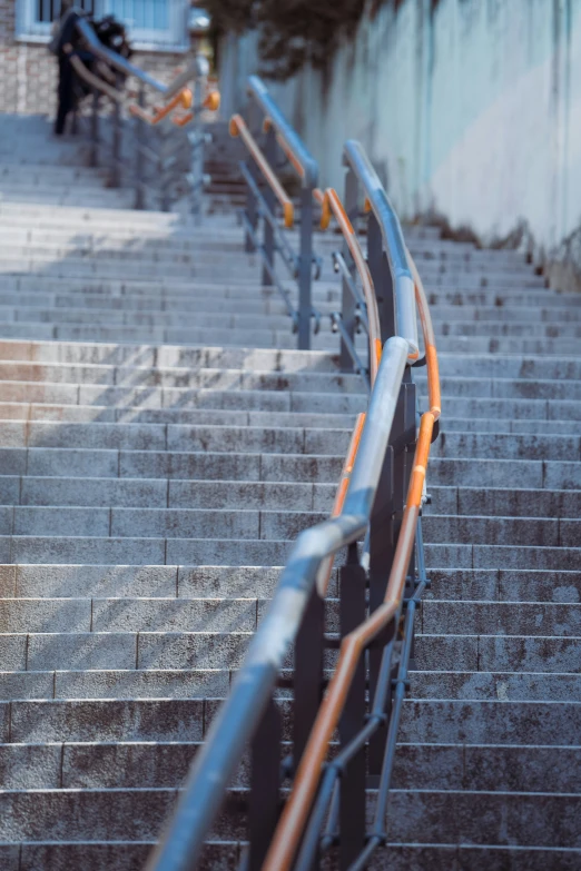 some stairs lead up and down to a person in the distance