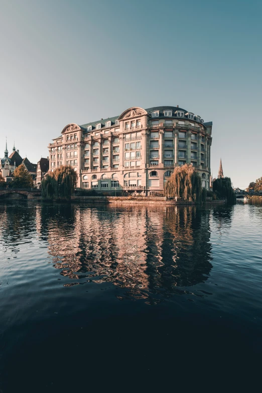 a large building in the middle of some water