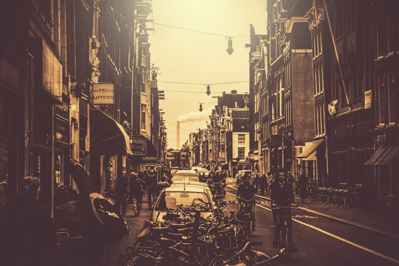 an empty street with several traffic lights above it