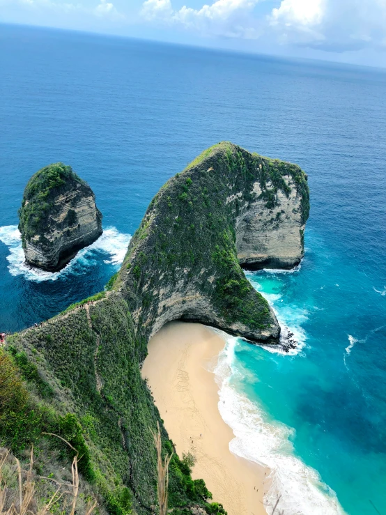 a beach and rocks in a very scenic area