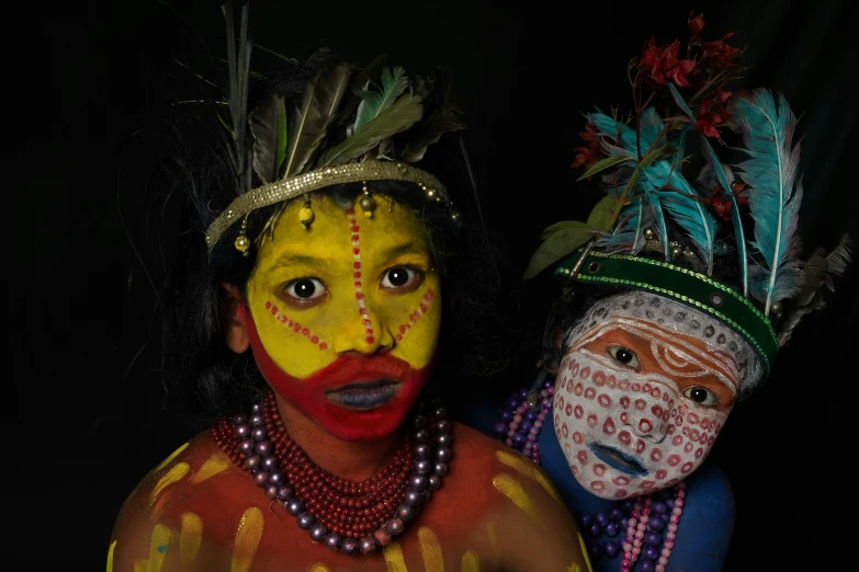 two people wearing face paint and body paint