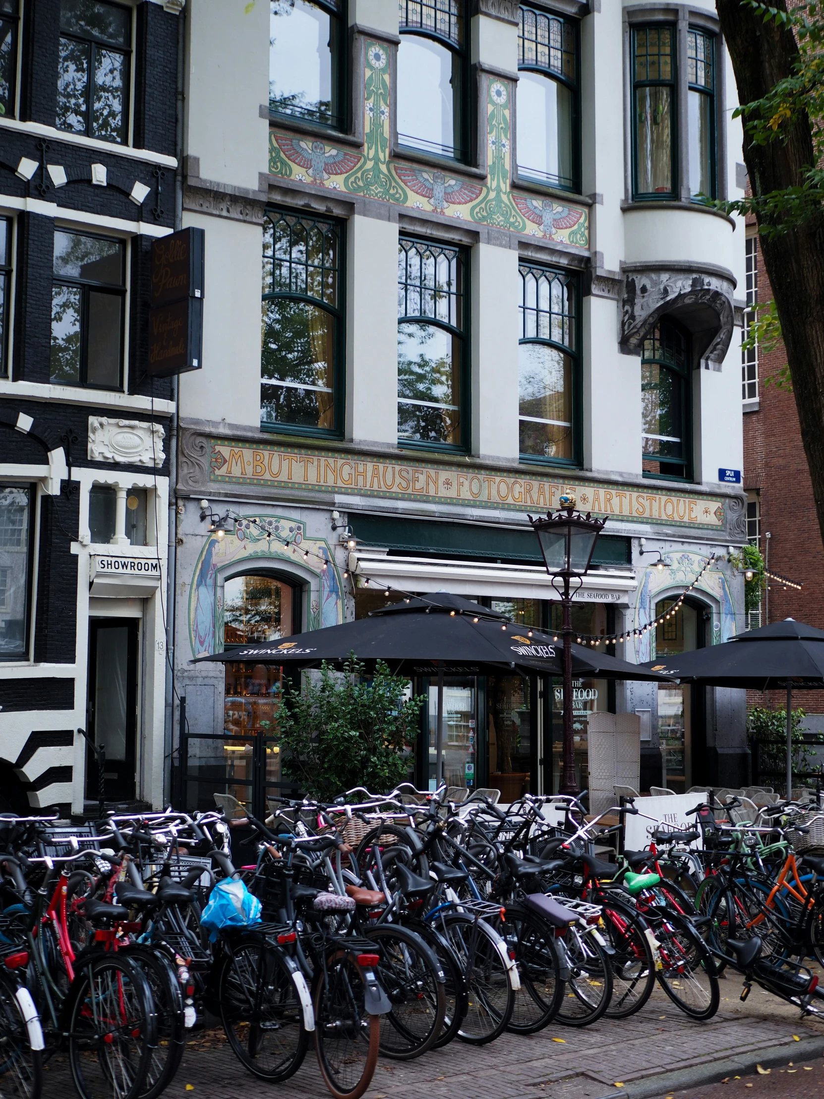 bicycles are lined up along the side of the street