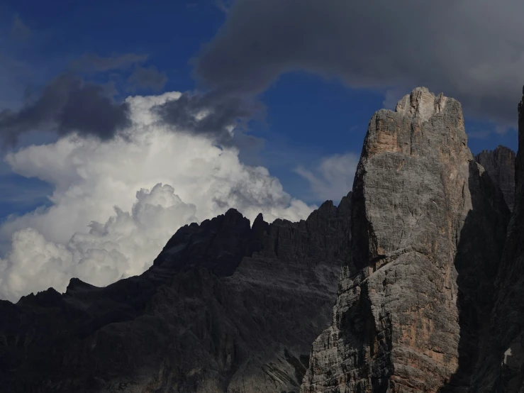 a large mountain range that is covered in clouds