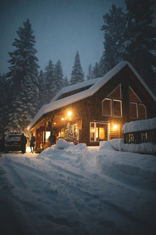 the dark exterior of a log house in winter