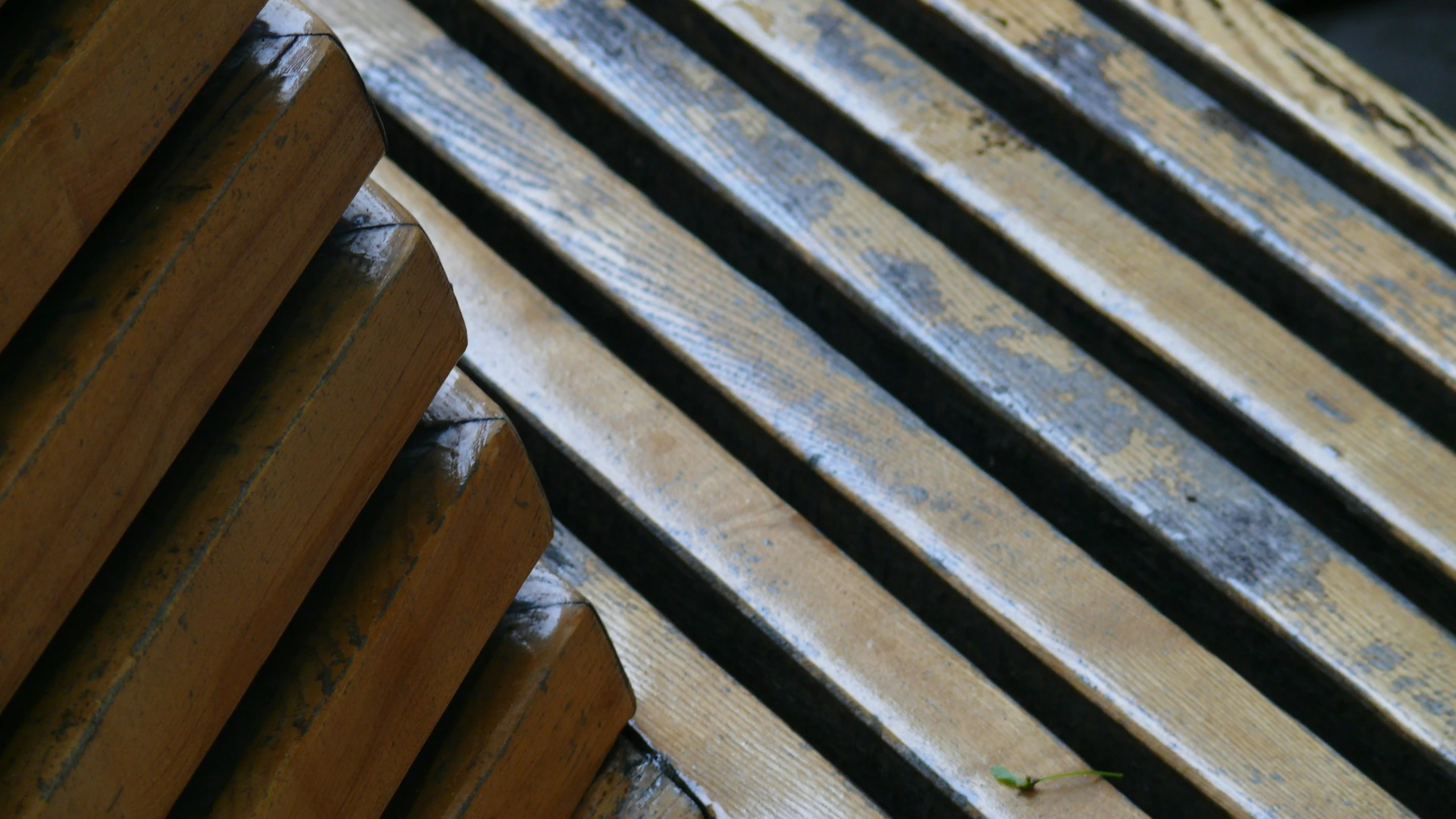 the wooden planks are stacked high to create a bench