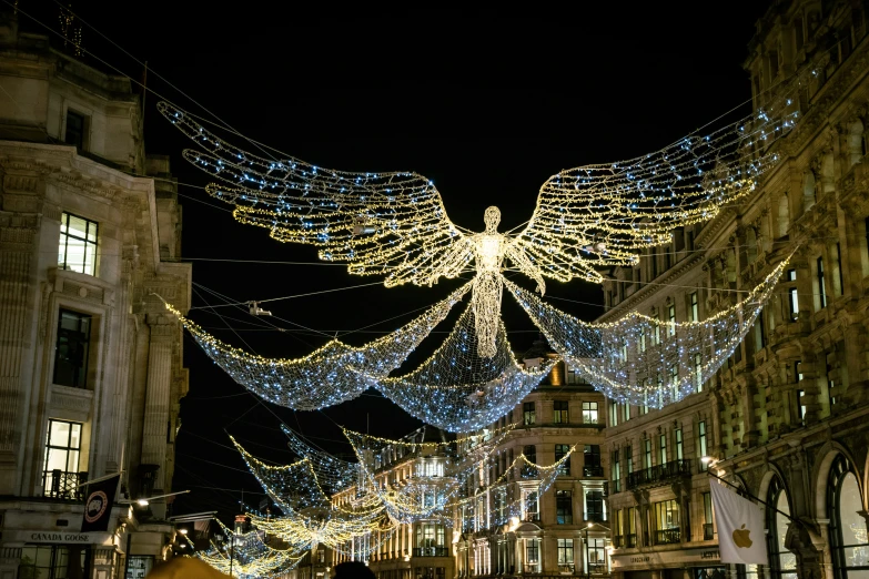 christmas lights decorate the buildings and surrounding streets