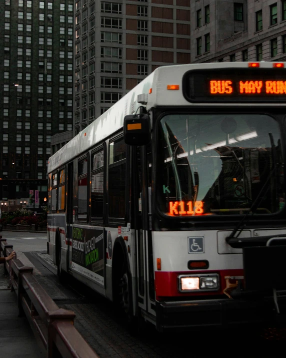 the city bus is stopped to pick up passengers