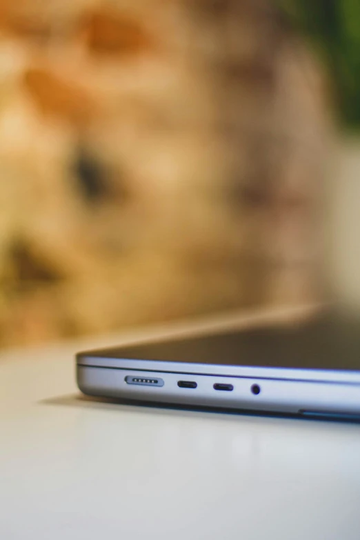 closeup of a black laptop on a white table