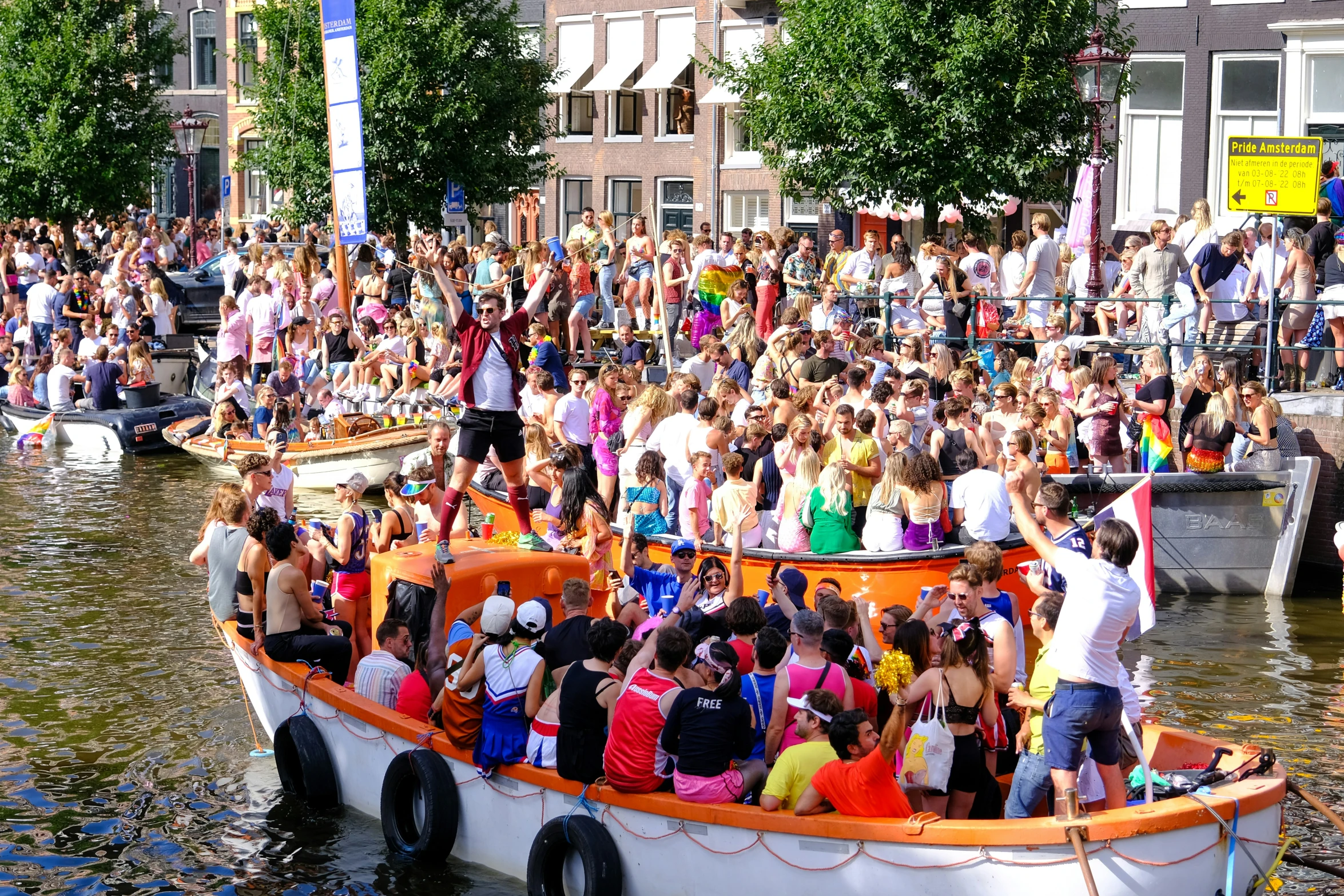 a boat full of people going down the river