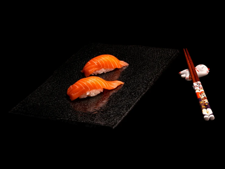 sushi on the table with chop sticks and chopsticks