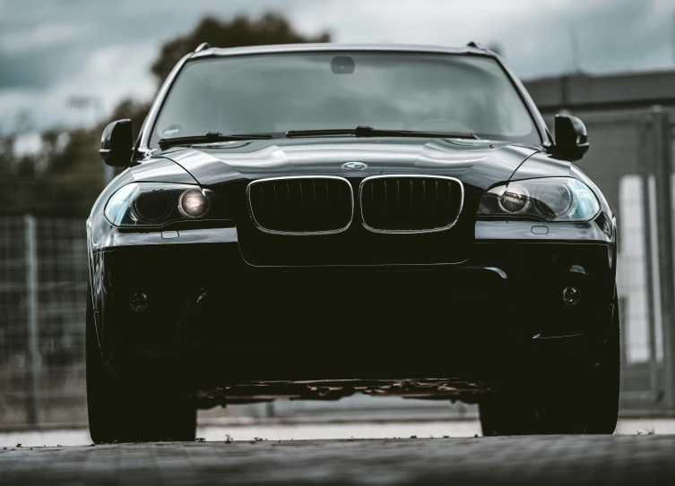 a dark car with some lights on the front