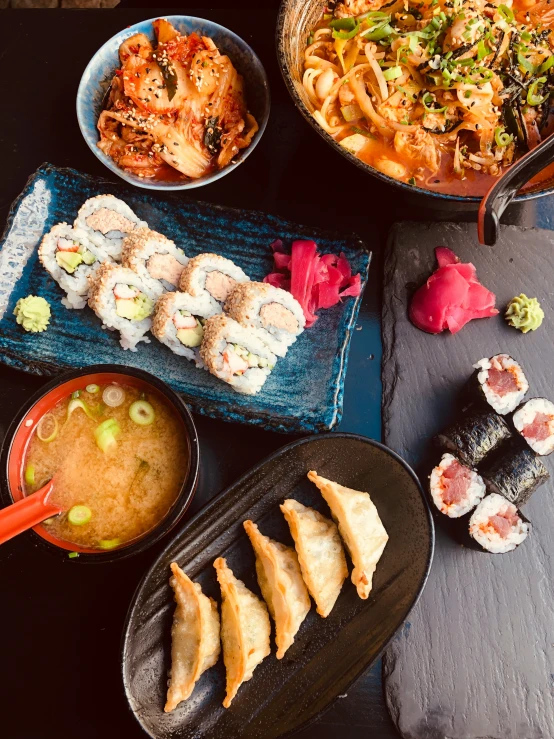 many types of food on a black table