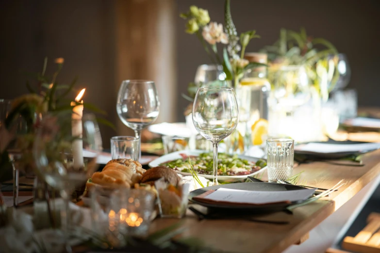 a table with some dishes and glasses on top