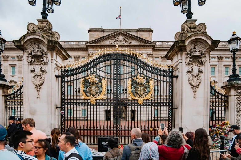 an ornate gate and front entrance to a building