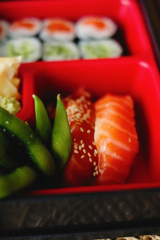 a close up of a bento box filled with different types of food