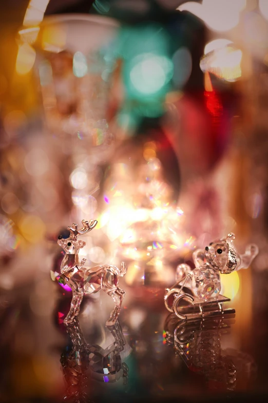 two shiny silver toys are sitting on a table