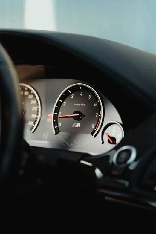 this is a car dashboard with gauges and digital display