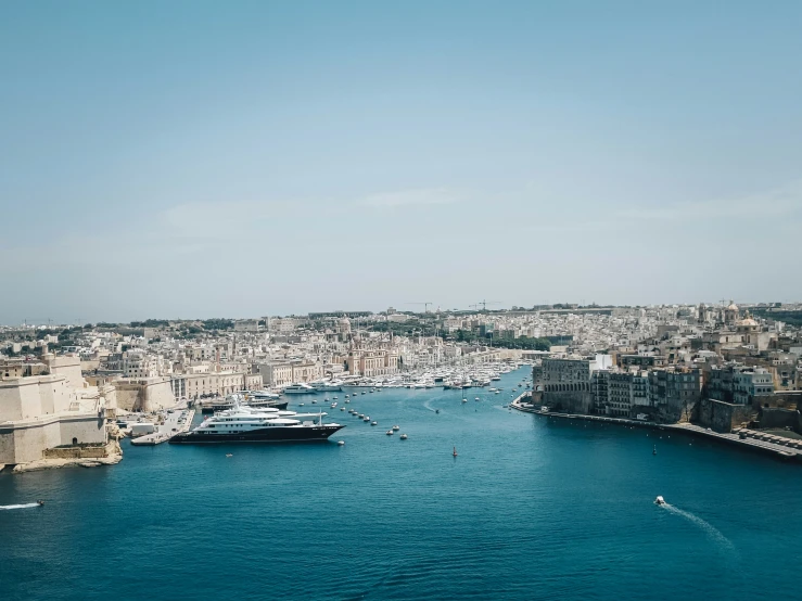 a small body of water that has a lot of boats floating on it