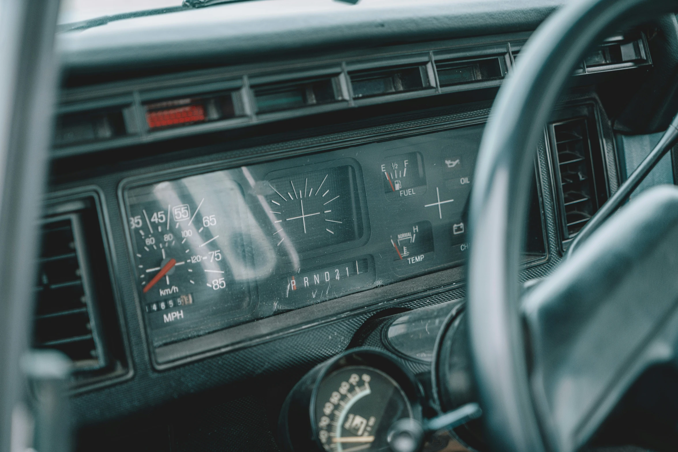 the dashboard and dash of a vehicle at the wheel