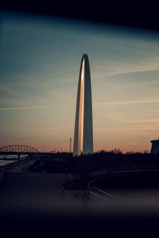 the tall obelisk is rising above the surrounding area