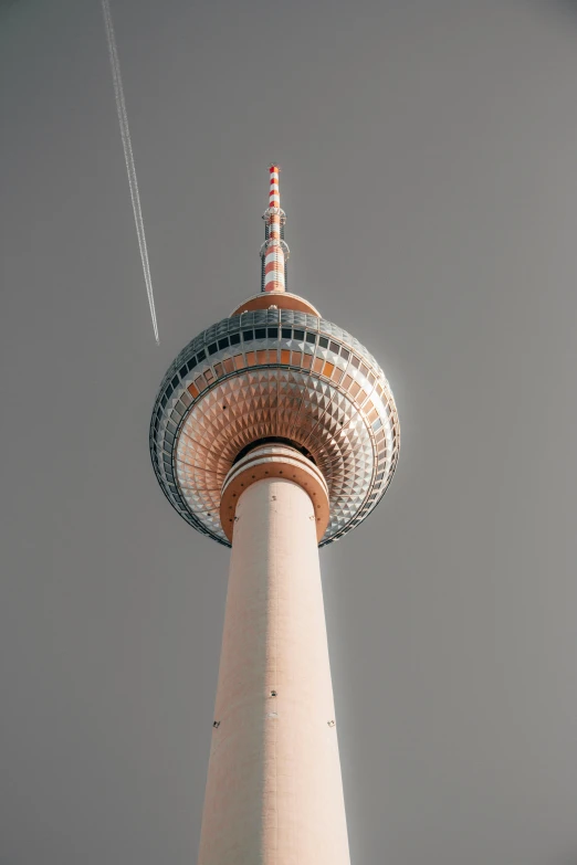 the top of a tall tower with a lot of sky in background