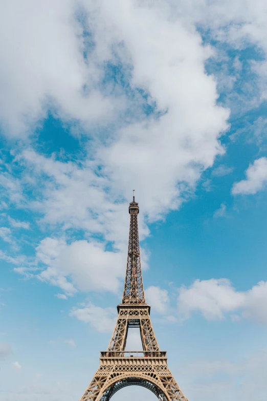 a tall tower is in the middle of a grassy area