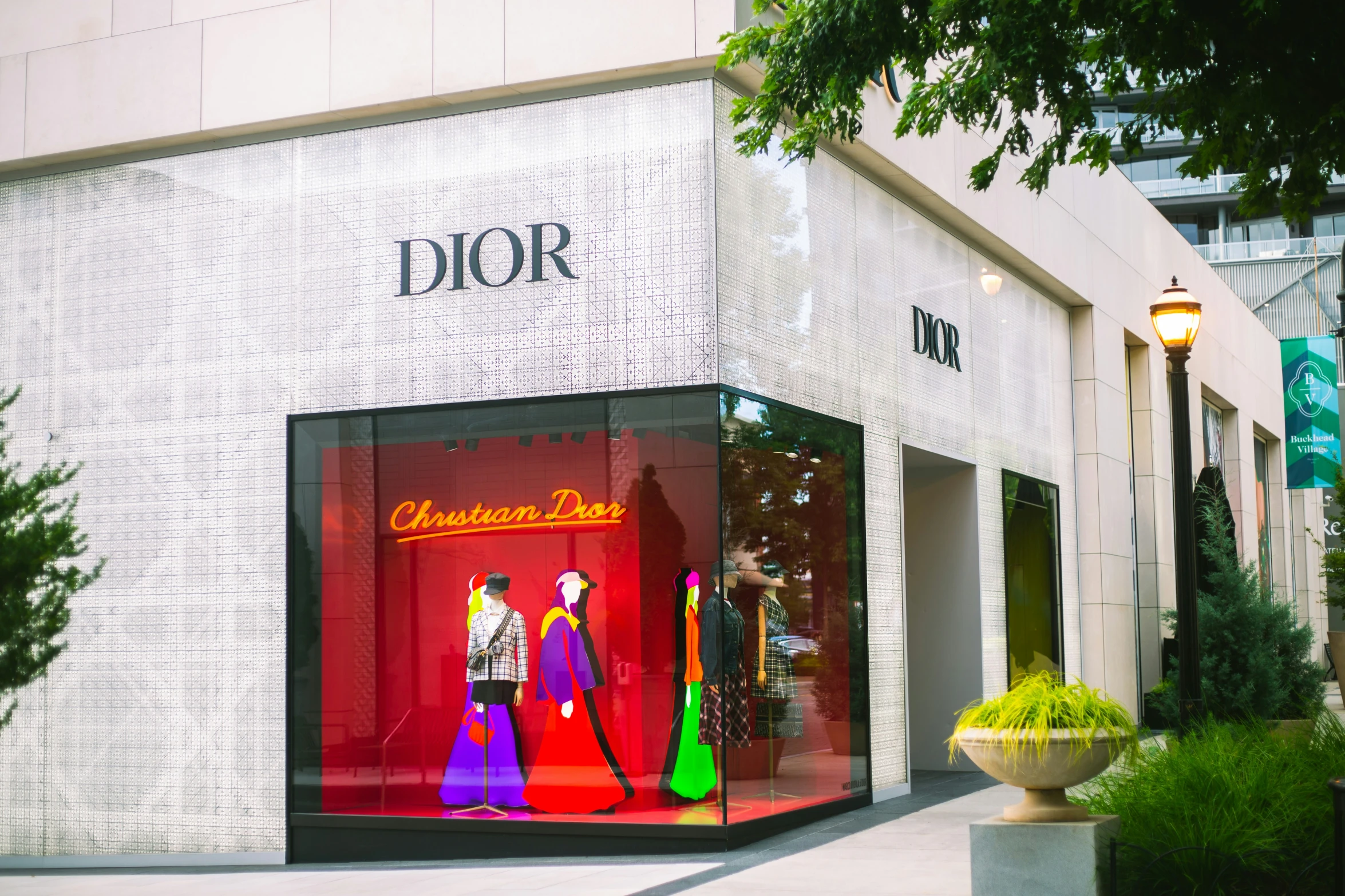 a window display of fashion clothes for dior