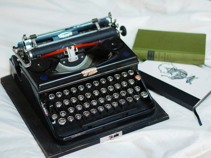 old fashion typewriter with red ribbon on white cloth