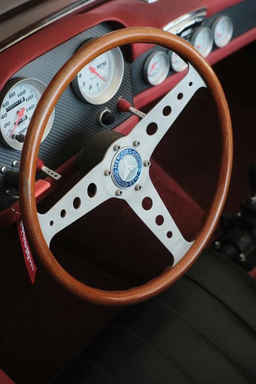 steering wheel and gauges in an old sports car