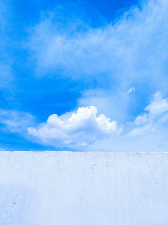 some clouds that are in the sky and one is a polar bear