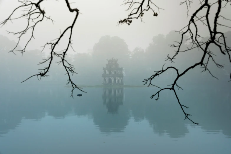 an image of a lake with birds perched on it