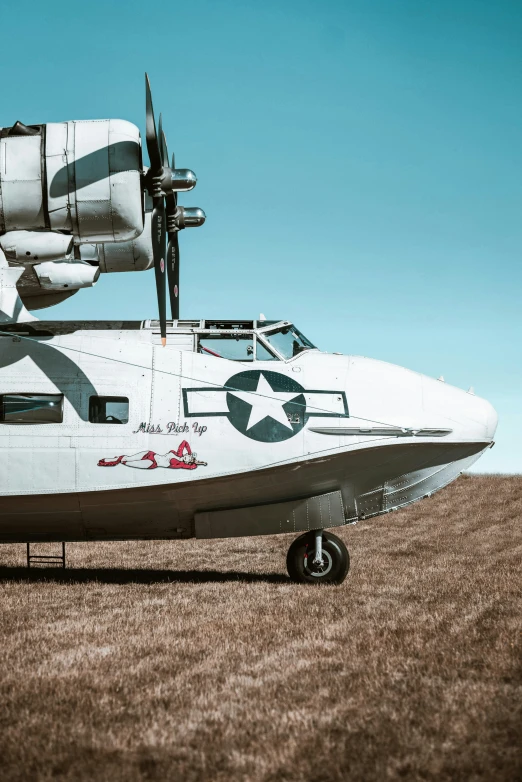 an old propeller airplane in the desert